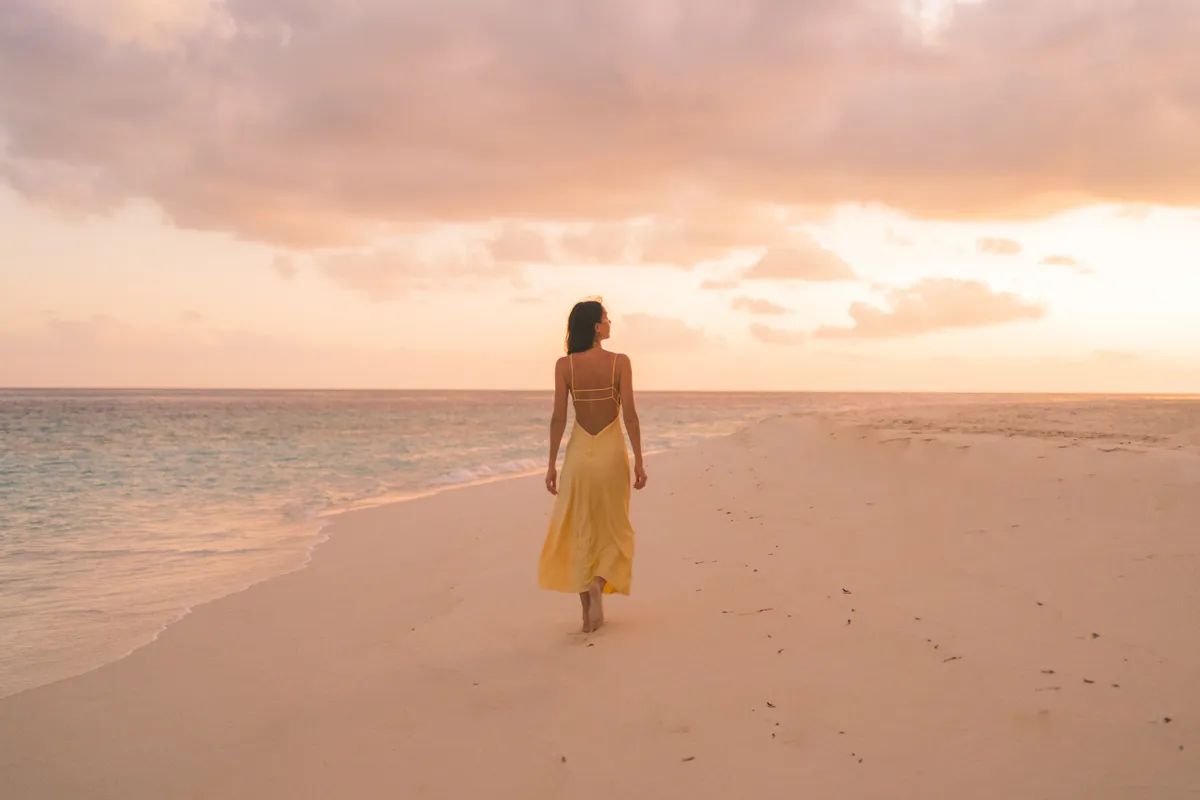 Portrait of amazing young woman enjoying alone on beach