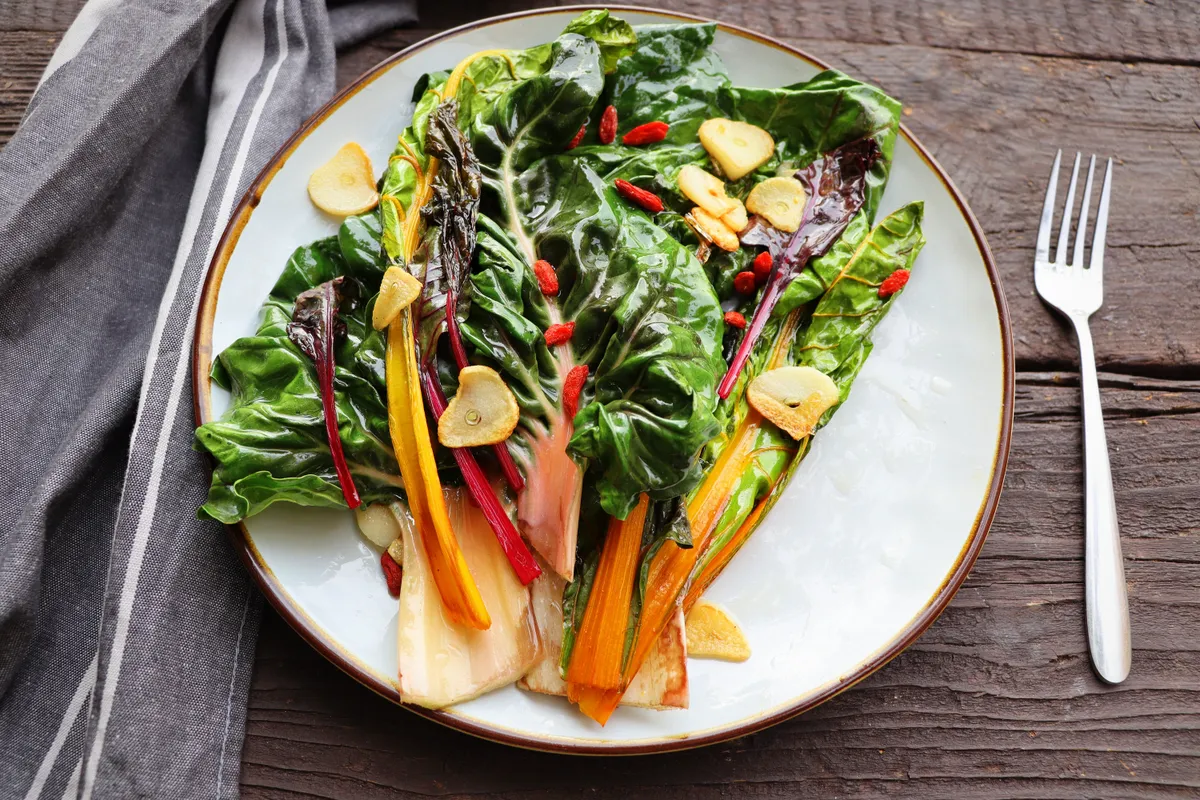 Wilted,Swiss,Chard,Salad,With,Butter,And,Garlic,On,Rustic