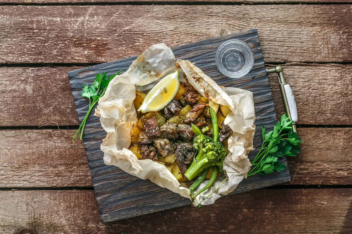 Lamb,Kleftiko,,Potato,And,Vegetables,Served,On,Wooden,Cutin,Board,