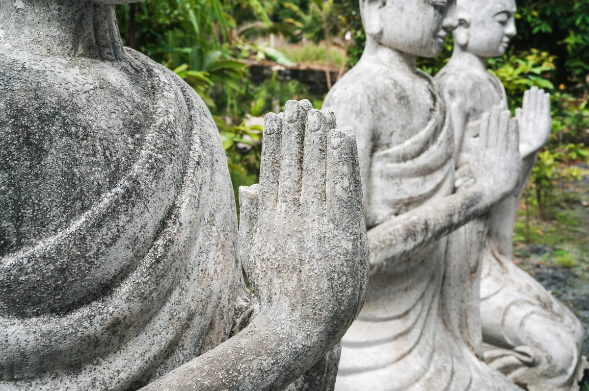 Close-up,Of,The,Folded,Arms,Of,The,Buddha,Statue.,The
