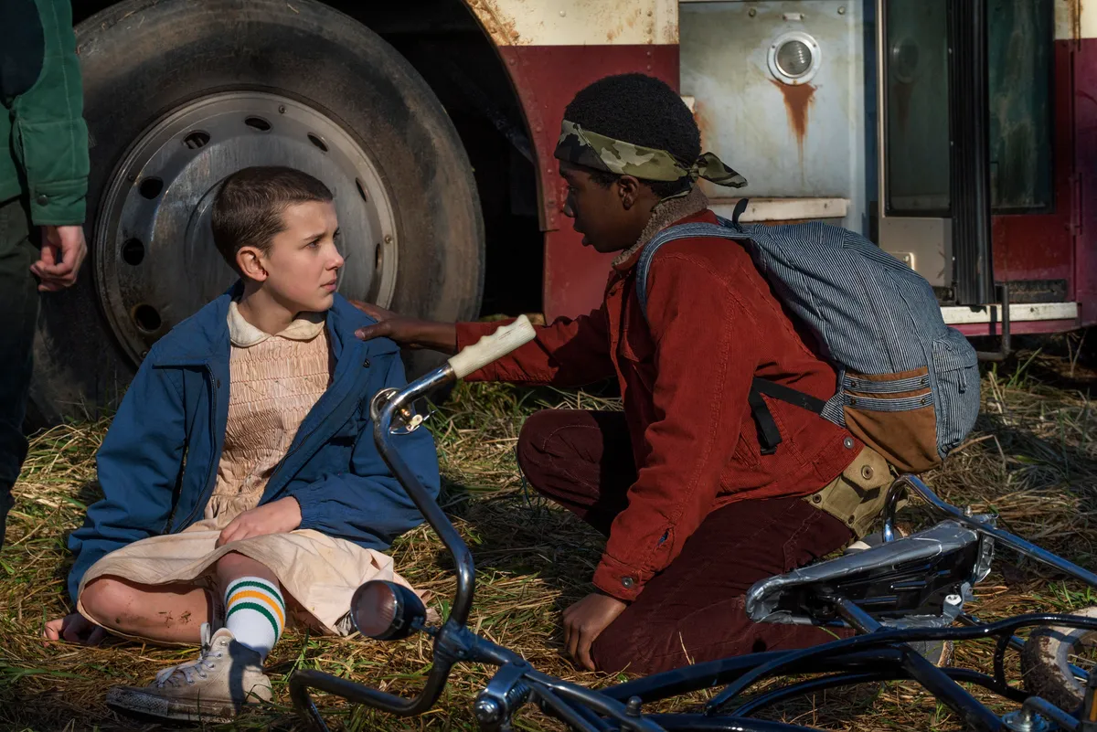 CALEB MCLAUGHLIN and MILLIE BOBBY BROWN in STRANGER THINGS (2016), directed by MATT DUFFER and ROSS DUFFER.