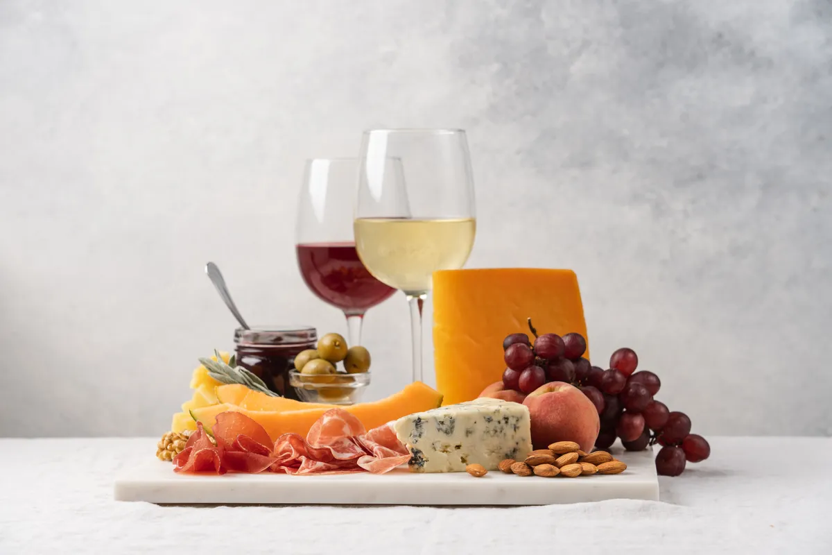 Assorted,Cheese,,Ham,,Fruit,,Jam,,Bread,Sticks,,Nuts.,Cheese,Platter.