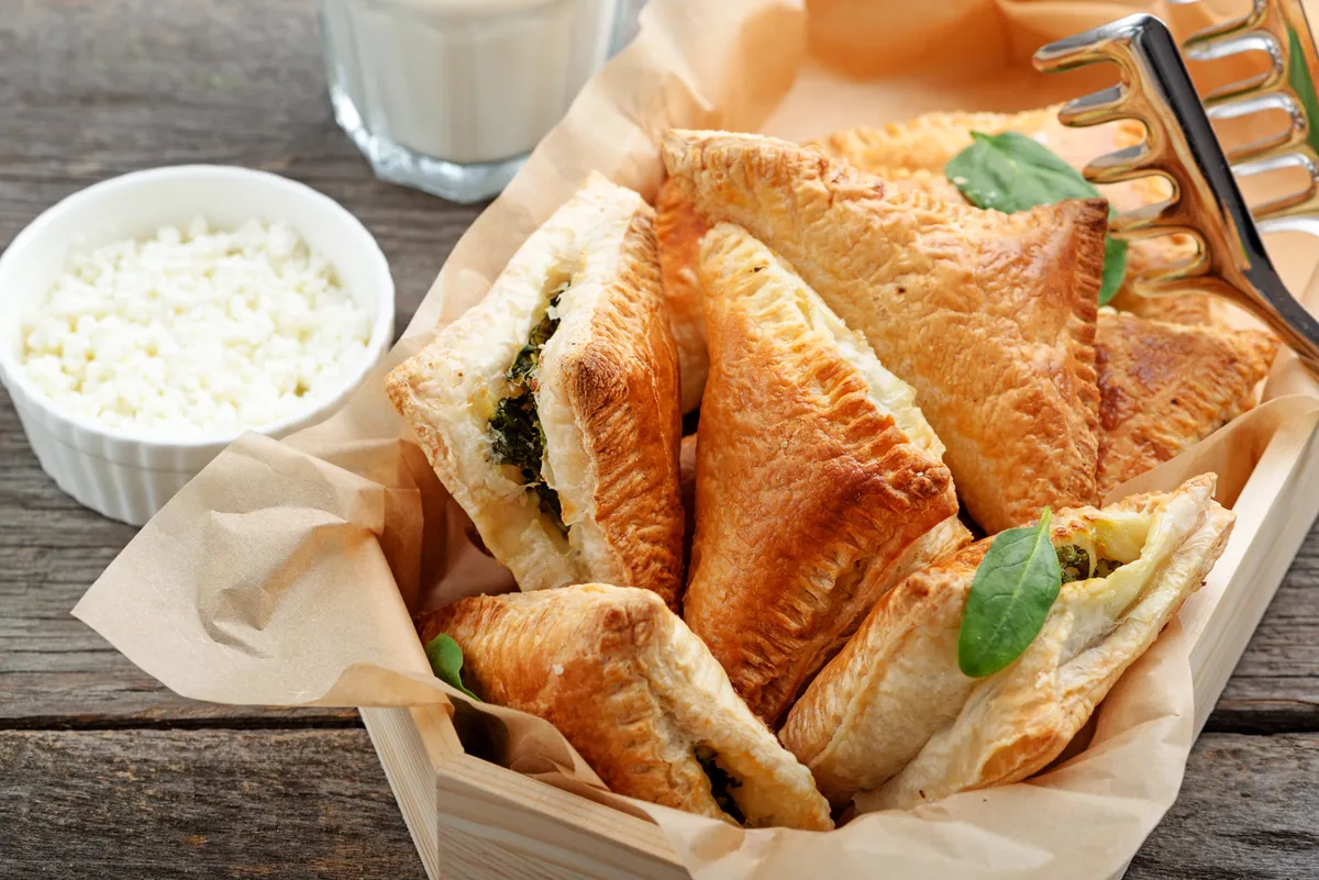 Puff,Pastry,Triangles,Filled,With,Feta,Cheese,And,Spinach,On