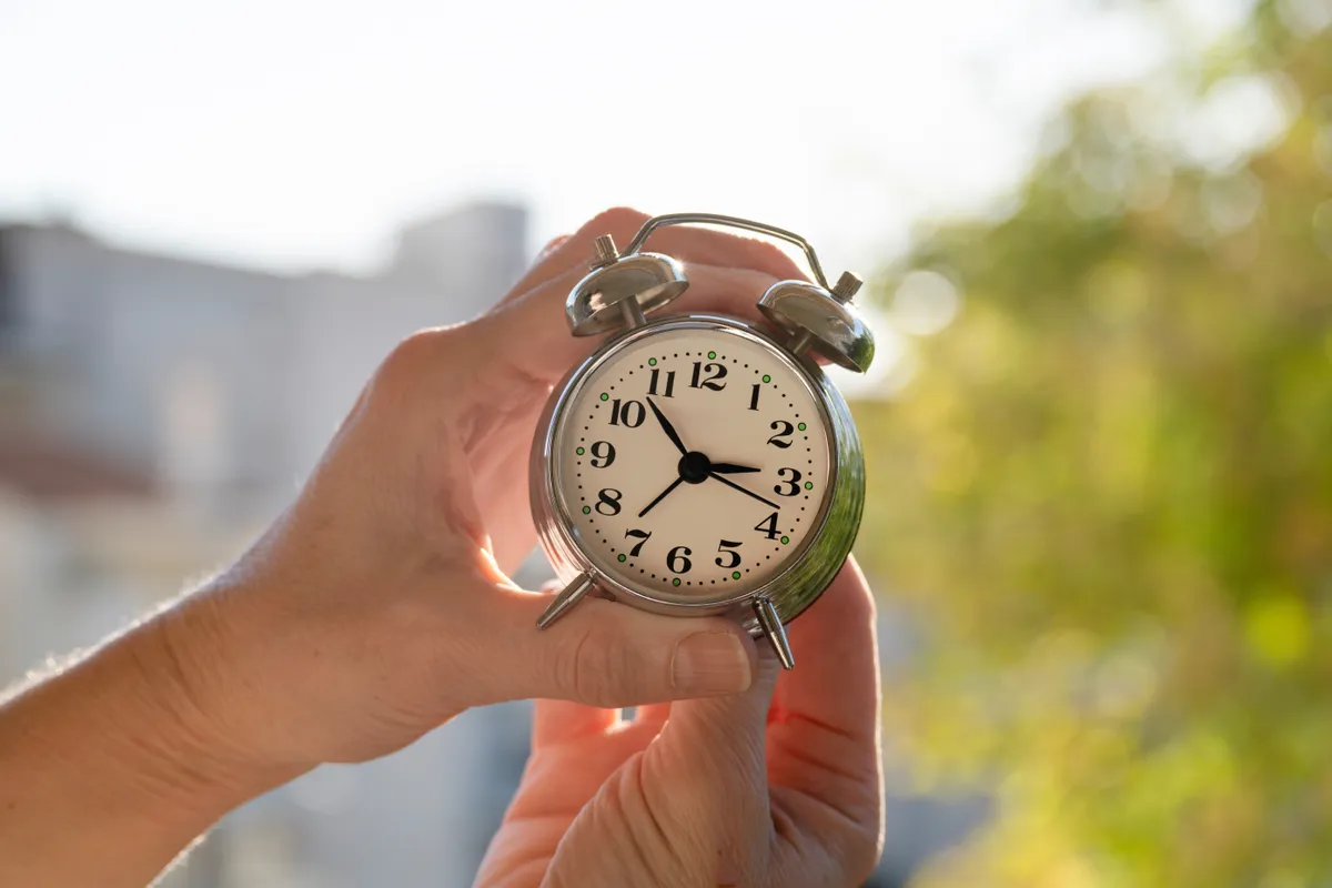 Hands,Adjusting,Or,Changing,The,Time,On,Clock
