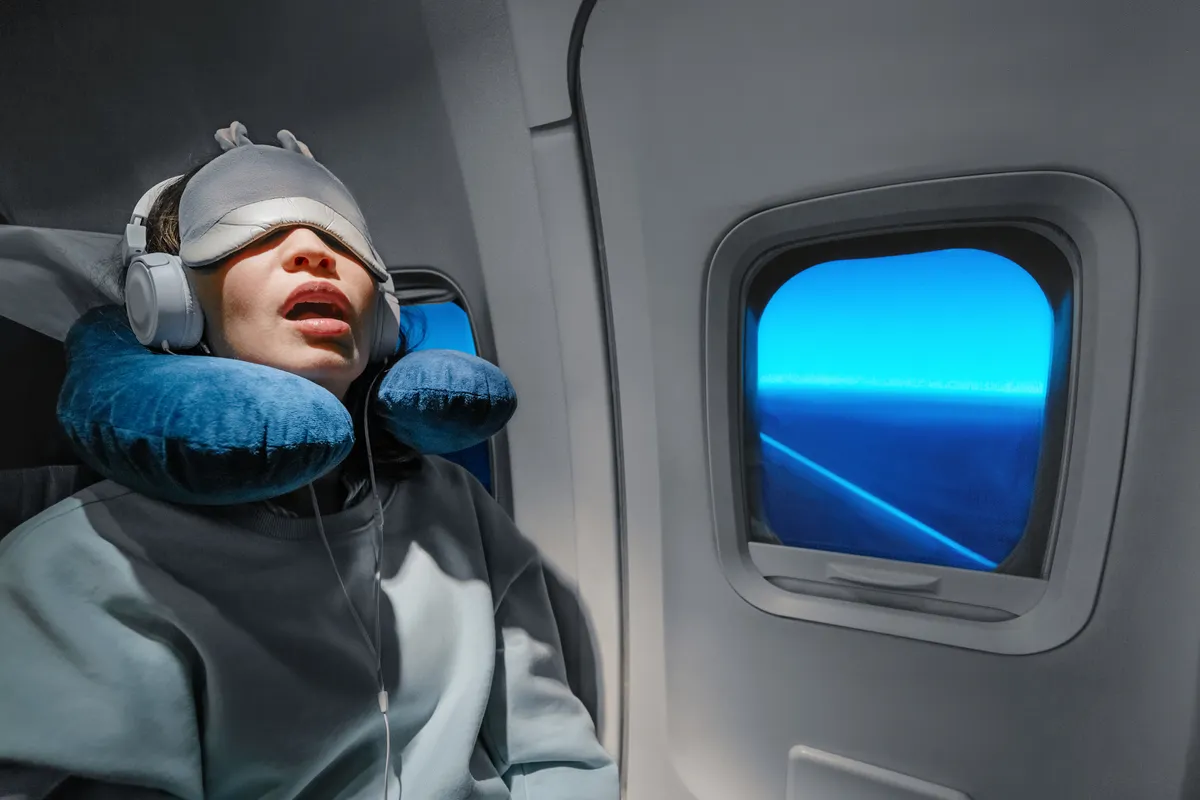 jetlag, alvó utas egy repülőgépen