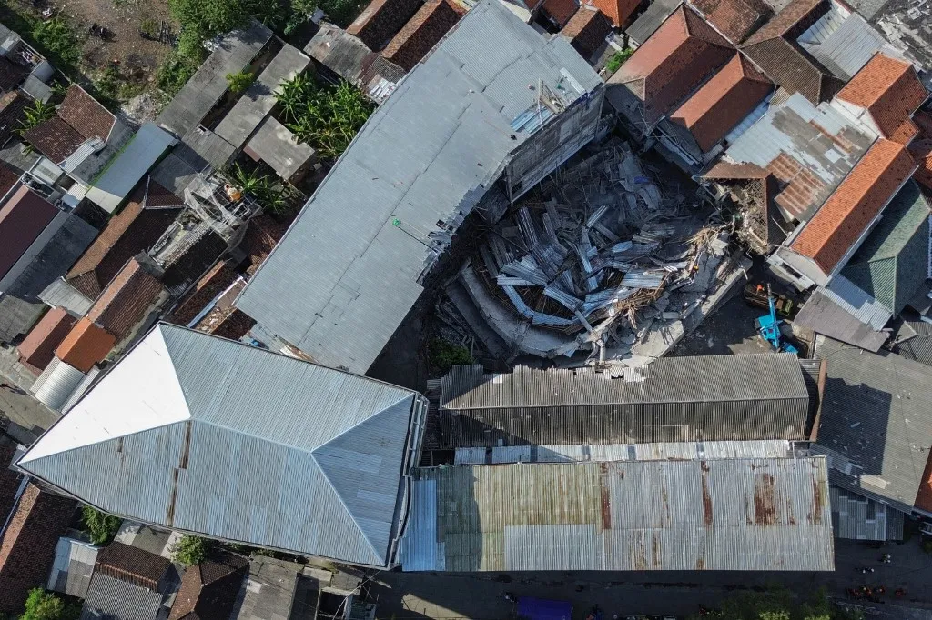 Indonesia battles to rescue trapped students at collapsed school building