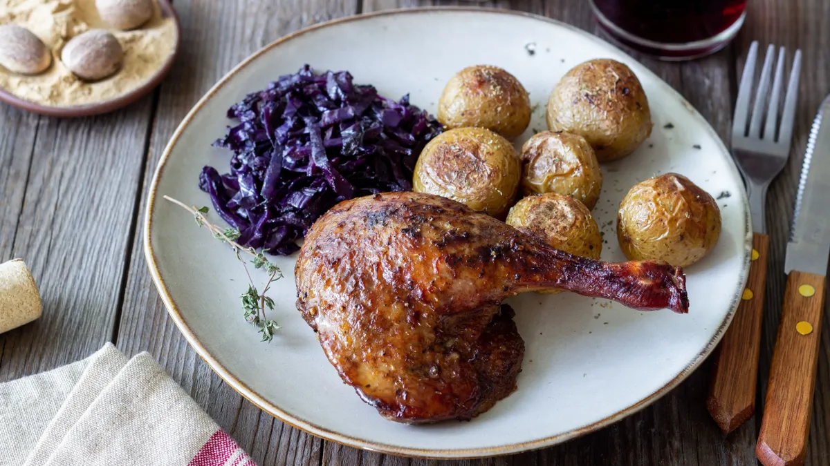 Baked,Duck,Leg,With,Potatoes,And,Red,Cabbage