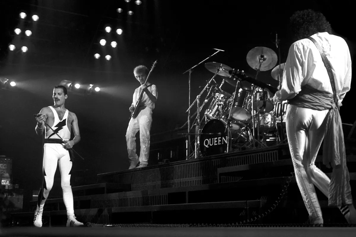 Freddie Mercury, John Deacon, Brian May (Queen)