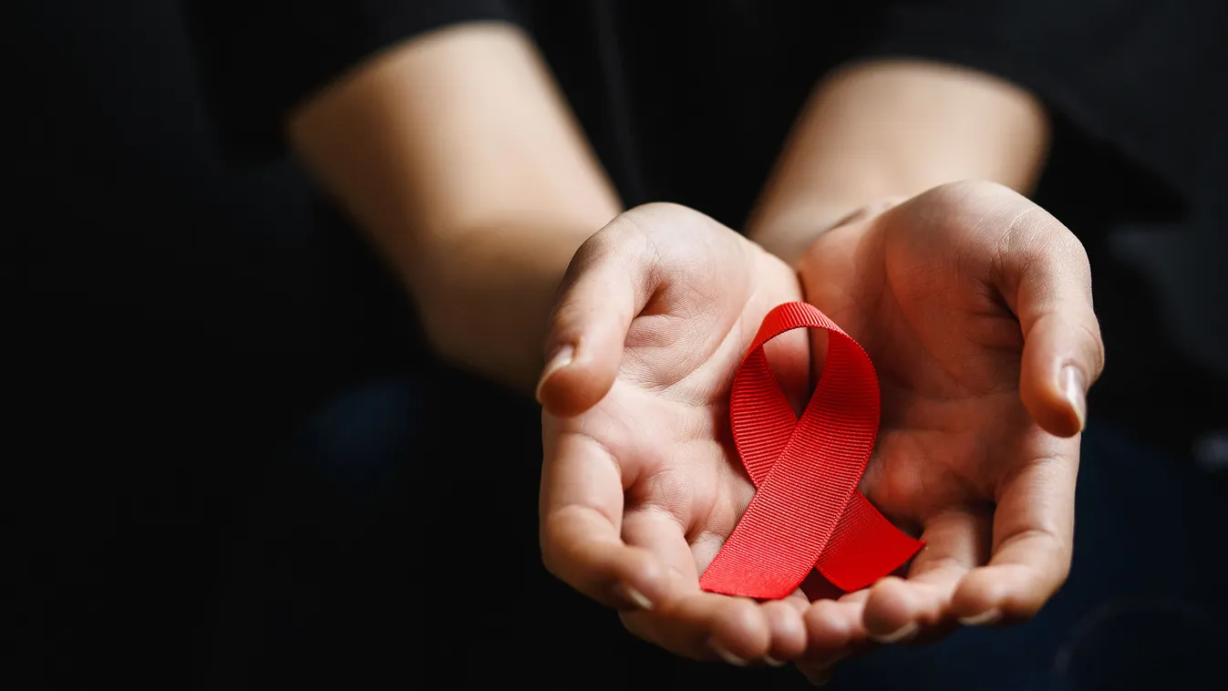 Piros szalag mint az AIDS elleni küzdelem szimbóluma