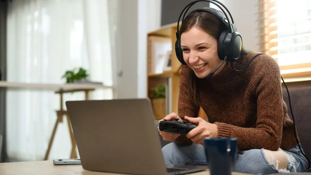 Young,Caucasian,Woman,In,Headset,Holding,Joystick,Playing,Video,Game