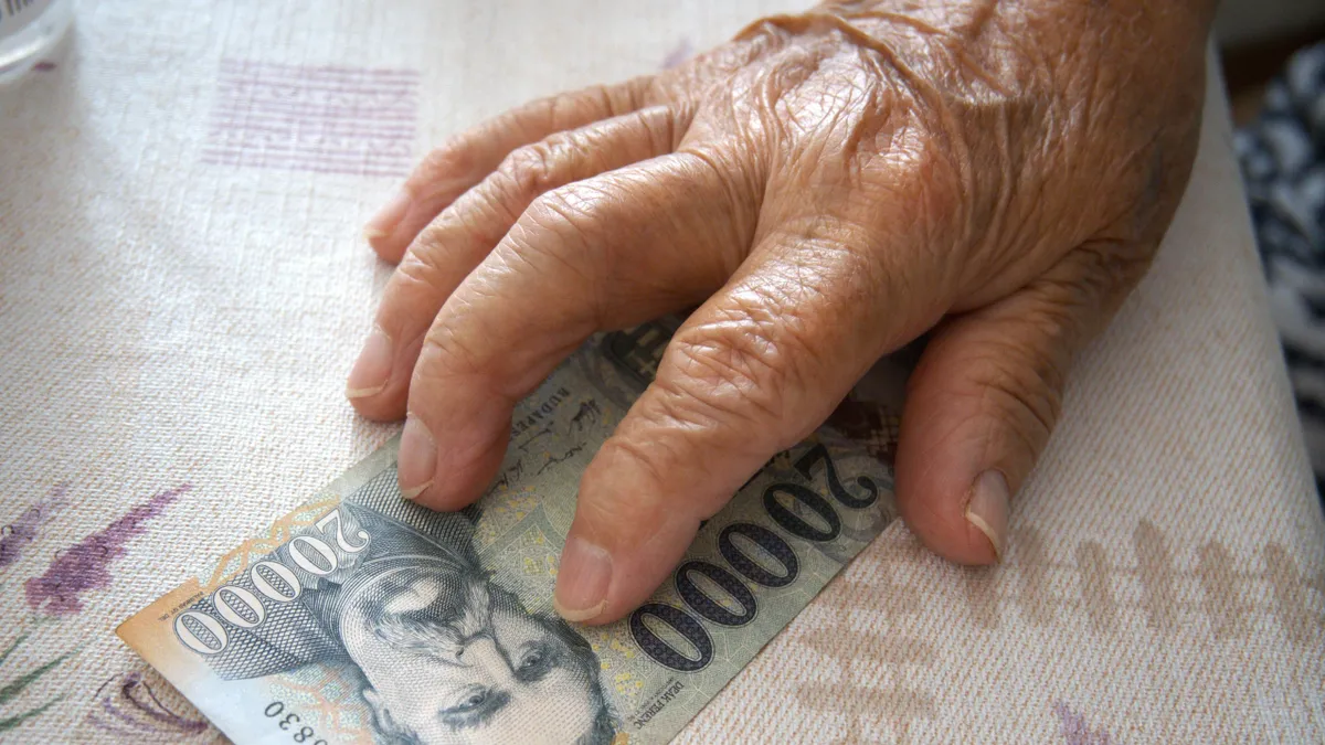 Close-up,Of,An,Elderly,Woman's,Hand,Holding,A,Hungarian,20000