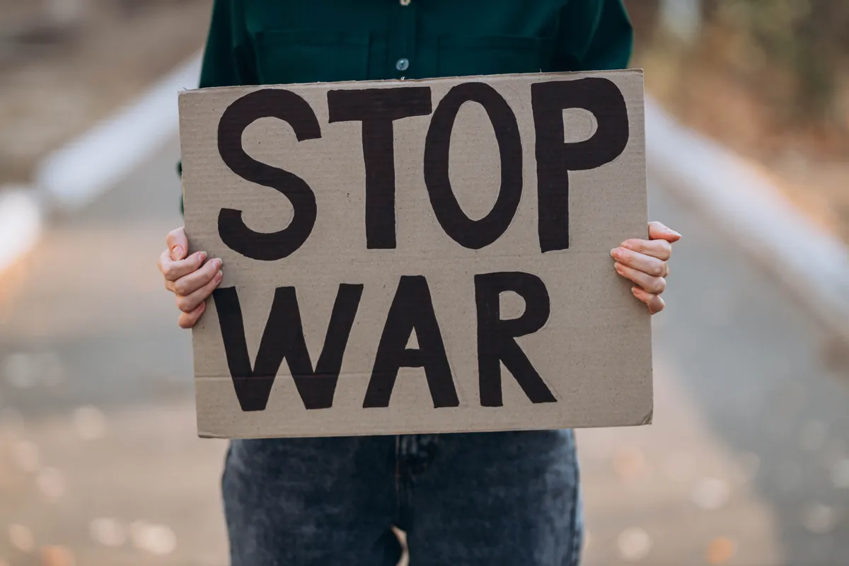 Ukrainian,Girl,Protests,War,,Holds,Banner,,Placard,With,Inscription,Message