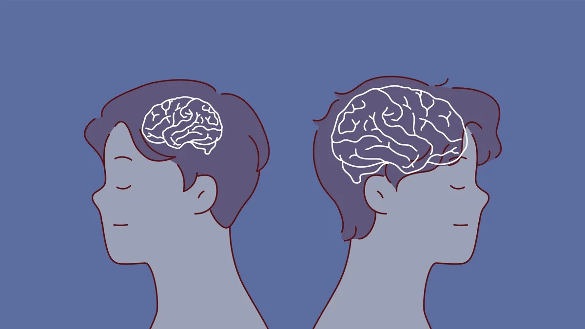 Két férfi egymásnak háttal állva az agytesztben.