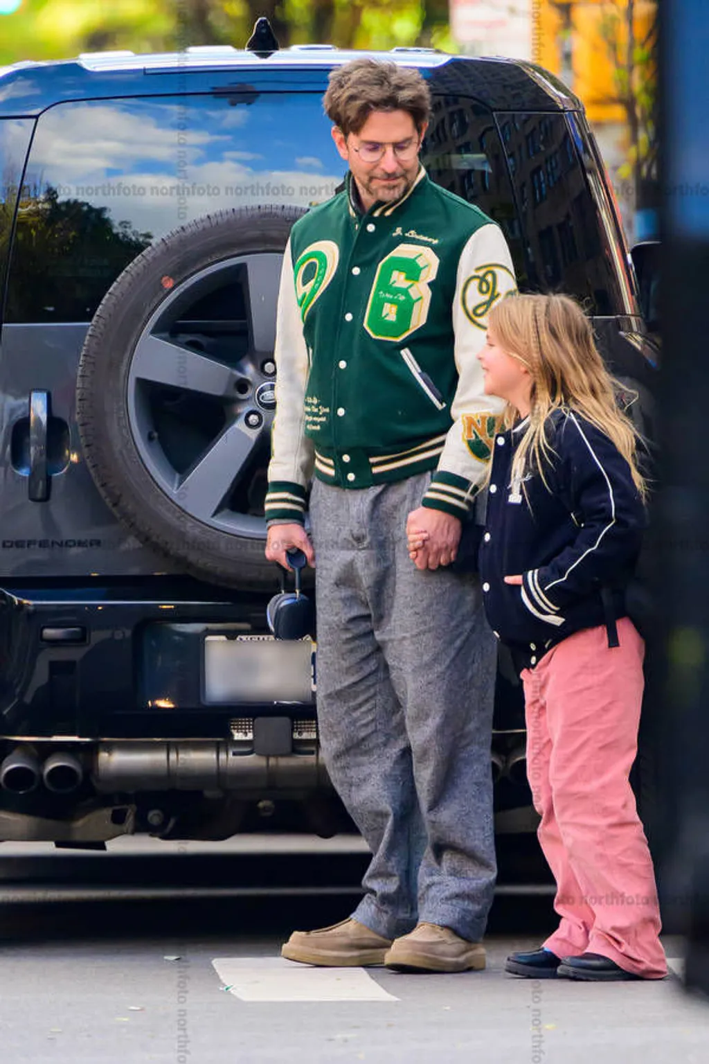 11/06/2025 Bradley Cooper heads out for ice cream with his daughter in New York City. The American actor wore a varsity jacket, grey trousers, and brown boots.

sales@theimagedirect.com Please byline:TheImageDirect.com