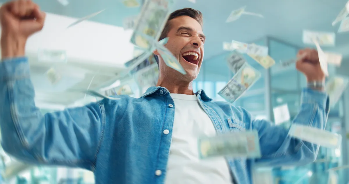 A horoszkóp alapján szerencsés férfi, aki élvezi a pénzesőt.