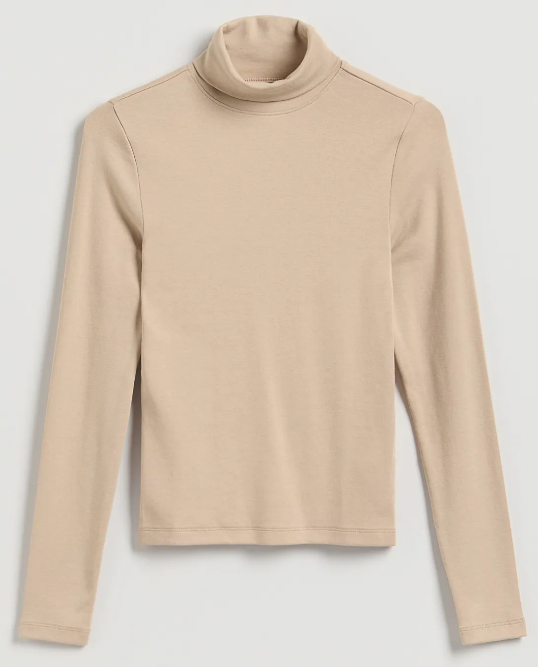 Karcsúsító tippek: szűk garbó.