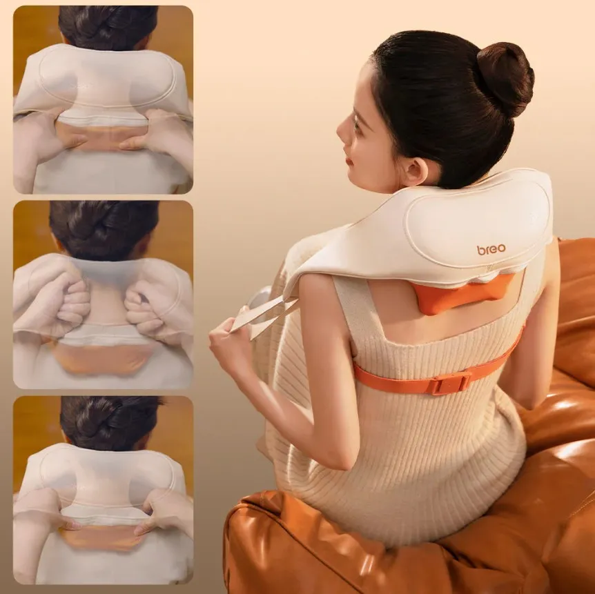 Egy nő nyak és vállmasszírozó készüléket visel.