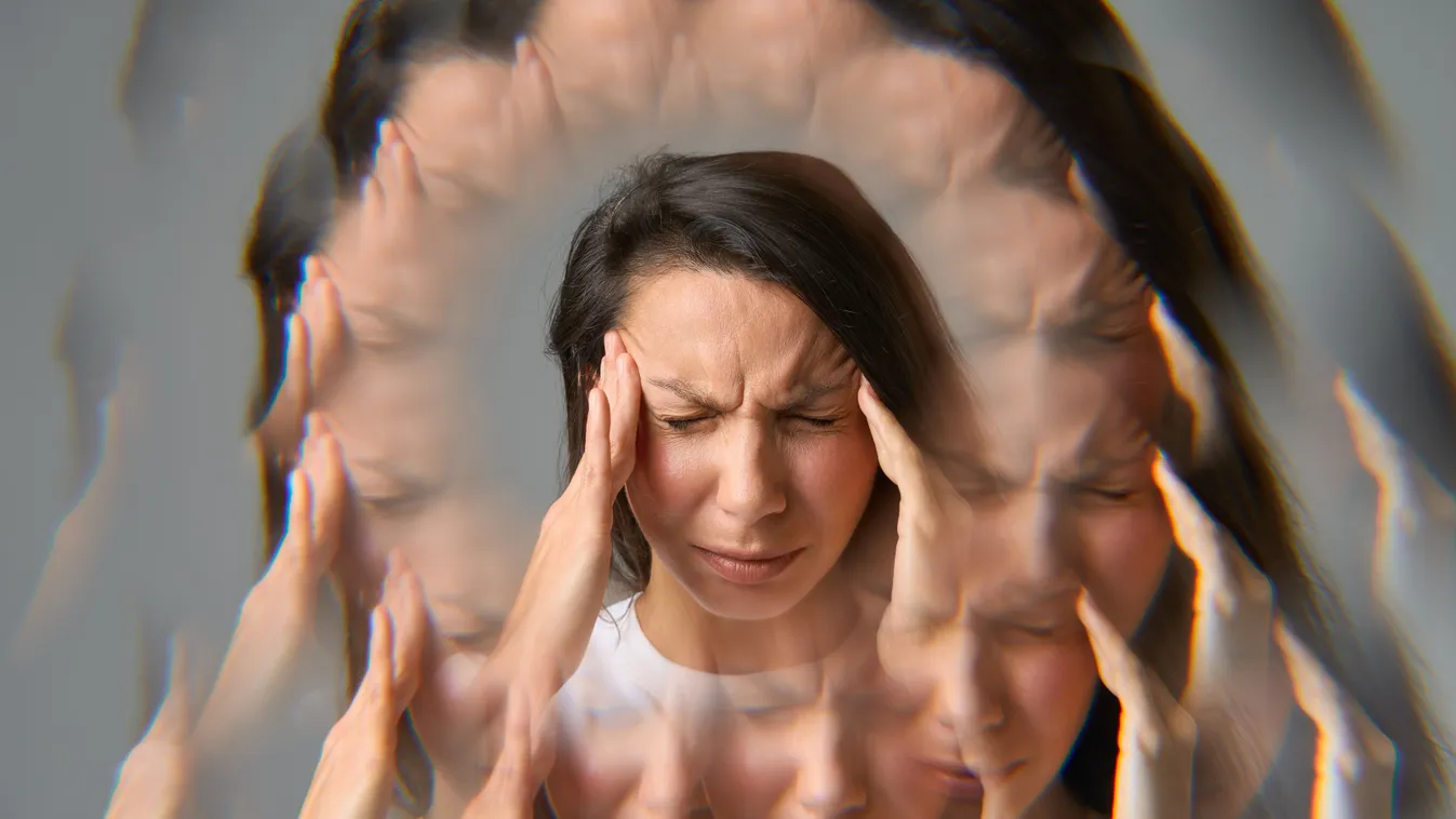 A fejfájás okait kutató, erős migrénnel küzdő nő a fejét fogva