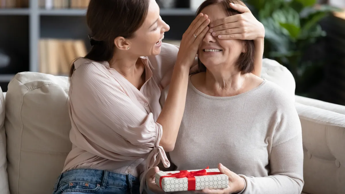 Loving,Adult,Grown,Up,Daughter,Prepared,For,Middle-aged,Mother,Surprise