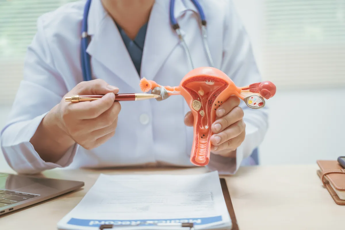 Male,Doctor,Treating,Female,Uterine,Diseases,At,Hospital,Table,,Discussing