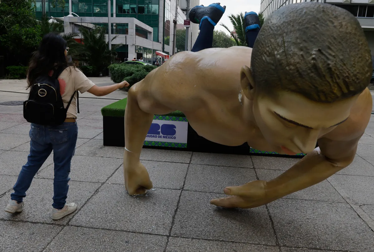 Members Of The CNTE Topple World Cup Sculptures In Mexico
