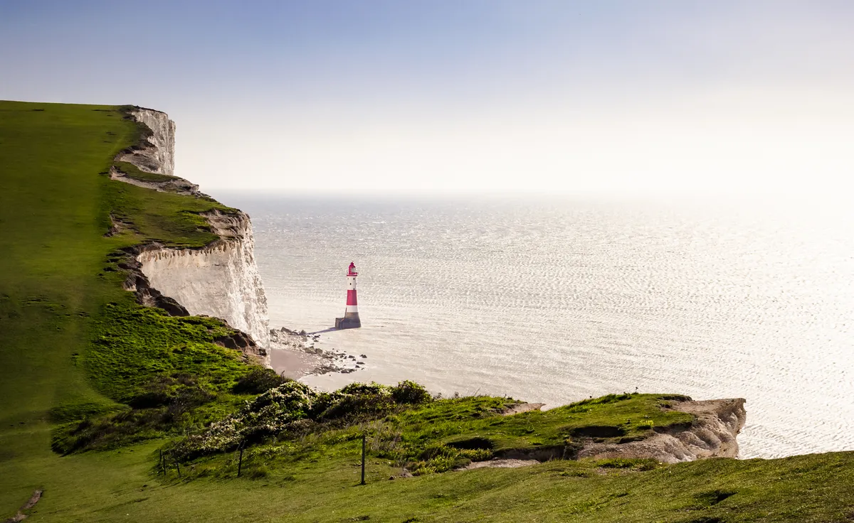 Beachy,Head,Lighthouse,Done,By,The,Water,In,Sunrise,Light