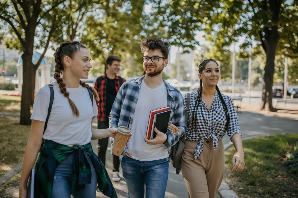 Cheerful students walking in campus